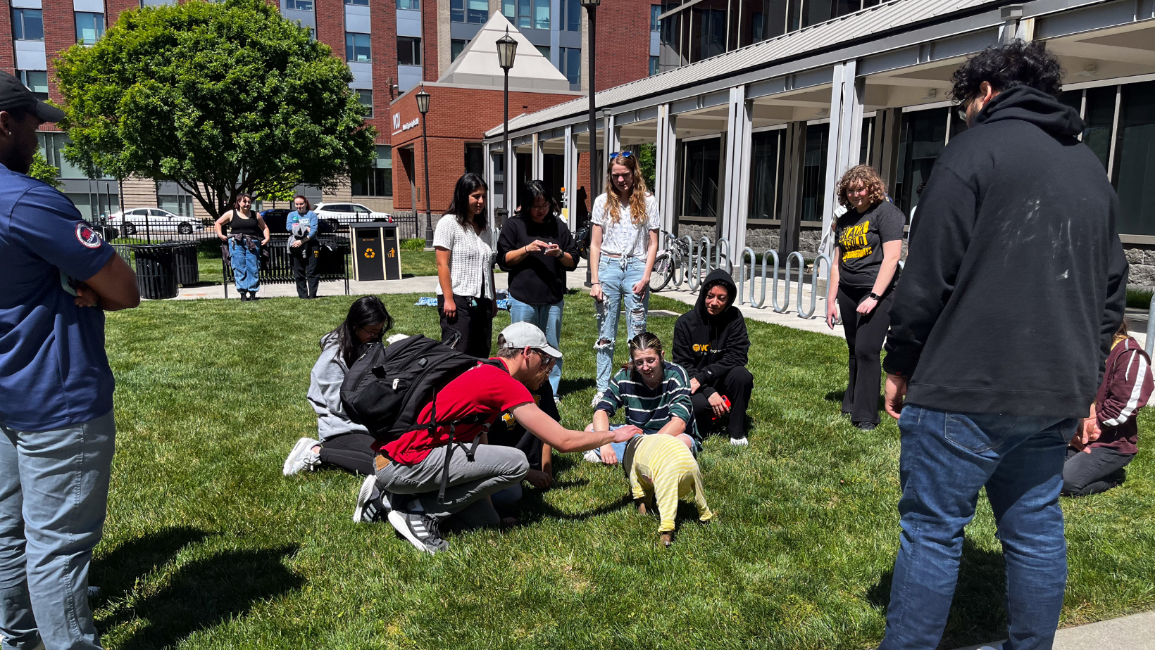 VCU students petting baby lamb